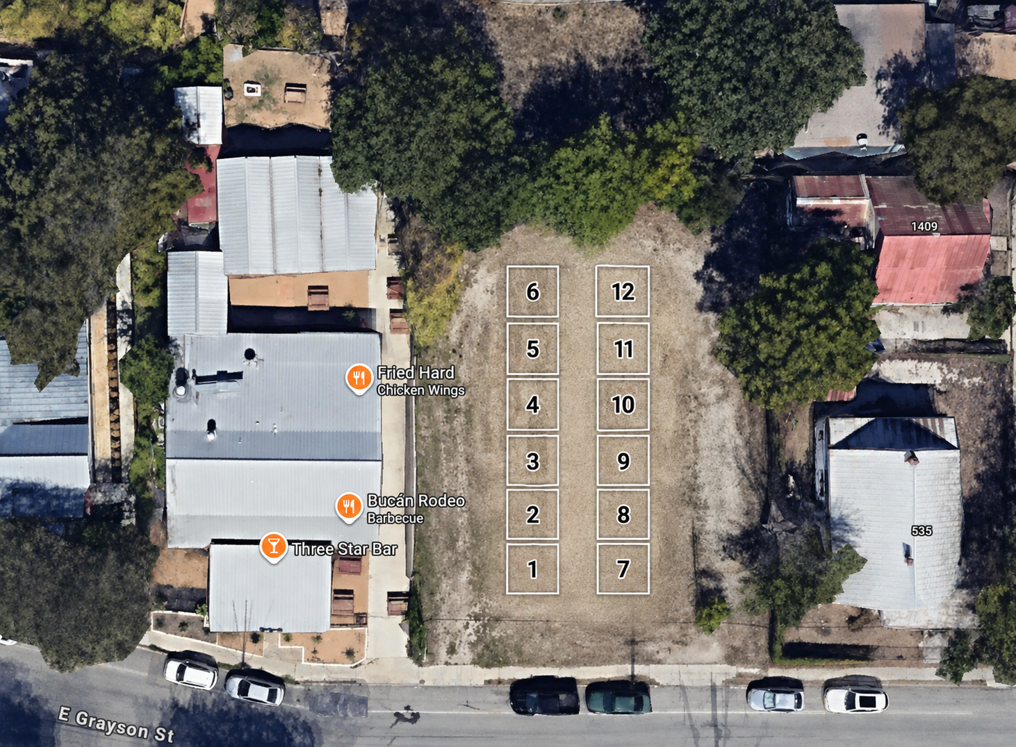 Aerial view of the lot at 527 East Grayson Street showing twelve numbered booth spaces in two rows of six